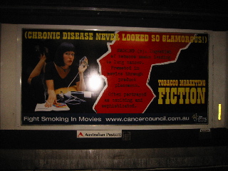 A Cancer Council of Australia billboard advertisement parodies the Pulp Fiction poster, showing a (bad) Uma Thurman look-alike with an oxygen mask, and the headline “Chronic Disease Never Looked So Glamorous!”