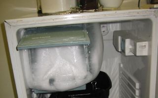 You guessed it. The freezer compartment is packed solid with ice.