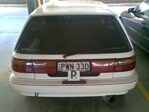 White hatchback, provisional driver, number-plate PWN-33D